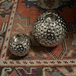 Set of round, silver candle holders